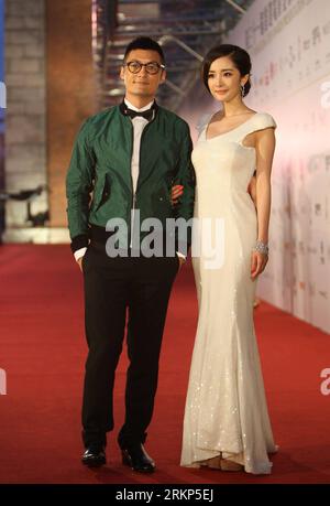 Bildnummer: 57897485  Datum: 15.04.2012  Copyright: imago/Xinhua (120415) -- HONG KONG, April 15, 2012 (Xinhua) -- Actress Yang Mi (R) and actor Shawn Yue arrive for the 31st Hong Kong Film Awards (HKFA) ceremony held at the Hong Kong Cultural Center in Hong Kong, south China, April 15, 2012. The annual Hong Kong Film Awards ceremony recognizes achievements in all aspects of filmmaking. It is the Hong Kong equivalent to the American Oscars and the British BAFTAS. (Xinhua/Li Qiuchan) CHINA-HONG KONG-HKFA CEREMONY-RED CARPET (CN) PUBLICATIONxNOTxINxCHN People Kultur Entertainment Film Preisverle Stock Photo