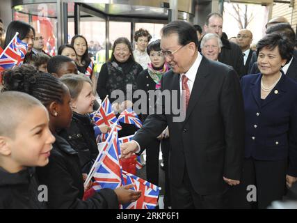 Bildnummer: 57911806  Datum: 18.04.2012  Copyright: imago/Xinhua (120418) -- LONDON, April 18, 2012 (Xinhua) -- Li Changchun (R Front), a member of the Standing Committee of the Political Bureau of the Central Committee of the Communist Party of China, is welcomed by students and staff of the Confucius Institute for Traditional Chinese Medicine at London South Bank University as he attends the fifth anniversary celebration of the institute in London, capital of Britain, April 18, 2012. (Xinhua/Ma Zhancheng) (lfj) BRITAIN-LONDON-LI CHANGCHUN-CONFUCIUS INSTITUTE-VISIT PUBLICATIONxNOTxINxCHN Peop Stock Photo