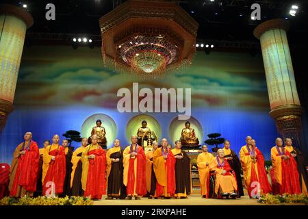 Bildnummer: 57942992  Datum: 30.04.2012  Copyright: imago/Xinhua (120430) -- HONG KONG, April 30, 2012 (Xinhua) -- Kok Kwong (5th L, front), president of the Hong Kong Buddhist Association, gives benediction along with other eminent monks at the concluding ceremony of the Grand Blessing Ceremony for Worshipping Buddha s Parietal-Bone Relic in the Hong Kong Coliseum in south China s Hong Kong, April 30, 2012. Some 300,000 Buddhists paid homage to the sacred relic during the six-day Grand Blessing Ceremony, which concluded here on Monday. (Xinhua/Li Ying) (lmm) CHINA-HONG KONG-BUDDHA S PARIETAL- Stock Photo