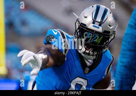 FILE – Carolina Panthers defensive end Brian Burns (53) wears a mask as he  warms up before an N …