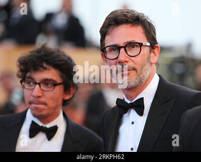Bildnummer: 57996368  Datum: 16.05.2012  Copyright: imago/Xinhua (120516) -- CANNES, May 16, 2012 (Xinhua) -- Academy Award winner, French director Michel Hazanavicius (R), poses on the red carpet during the opening ceremony of the 65th Cannes Film Festival in Cannes, southern France, May 16, 2012. The festival kicked off here on Wednesday. (Xinhua/Gao Jing) FRANCE-CANNES-FILM FESTIVAL-OPENING PUBLICATIONxNOTxINxCHN People Kultur Entertainment Film Filmfestival Festival Filmfestspiele 65 Cannes Pressetermin Premiere Filmpremiere xdp x0x 2012 quer premiumd      57996368 Date 16 05 2012 Copyrigh Stock Photo