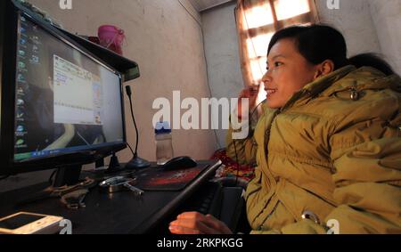 Bildnummer: 58016573  Datum: 22.05.2012  Copyright: imago/Xinhua (120522) -- BEIJING, May 22, 2012 (Xinhua) -- The file photo taken on Jan. 18, 2011 shows Su Xiaolin doing business online at her home in Qidong, east China s Jiangsu Province. More and more physically disabled in China have found ways to join the country s get rich rush, which could have left them behind if not for the Internet. According to sources with Taobao, the country s largest e-commerce platform, more than 30,000 disabled across the country are managing online stores at Taobao.com. Official statistics show that China cur Stock Photo