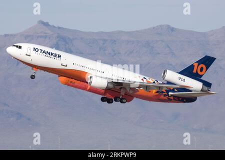 A McDonnell Douglas DC-10 airtanker takes off from Gateway Airport with a load of flame retardant to drop on a wildfire. Stock Photo
