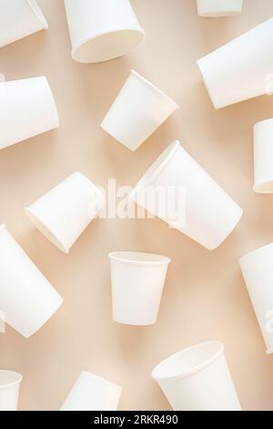 Cardboard cups for coffee or tea flat lay on neutral background. Stock Photo