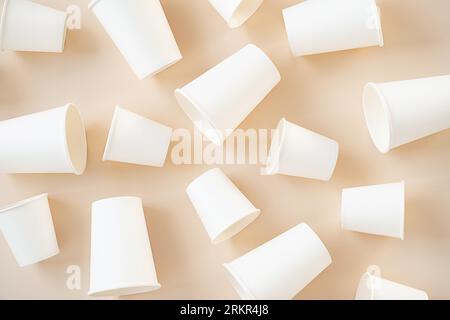 Cardboard cups for coffee or tea flat lay on neutral background. Stock Photo
