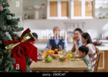 multi generational asian family gathering together having meal on christmas day Stock Photo
