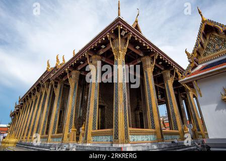 The artistic architecture and decoration of Phra Ubosot or The Chapel of The Emerald Buddha or Wat Phra Kaew, The Grand Palace, Thailand - The main Ph Stock Photo