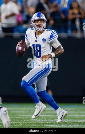 Detroit Lions quarterback Adrian Martinez (18) gets away from New York  Giants linebacker Tashawn Bower (94) while carrying the ball during the  second half of an NFL preseason football game, Friday, Aug.