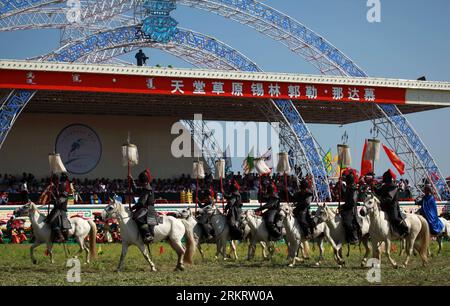 Bildnummer: 58310847  Datum: 05.08.2012  Copyright: imago/Xinhua (120805) -- XILINGOL, Aug. 5, 2012 (Xinhua) -- Herdsmen from West Ujimqin Banner perform during the opening ceremony of the 2nd Xilingol Nadam Festival in Xilinhot, north China s Inner Mongolia Autonomous Region, Aug. 5, 2012. Nadam, meaning entertainment and playing in Mongolian language, is a folk festival of the Mongolian ethnic group. (Xinhua/Zhang Ling) (mp) CHINA-INNER MONGOLIA-XILINGOL-NADAM FESTIVAL (CN) PUBLICATIONxNOTxINxCHN Gesellschaft x2x xkg 2012 quer  o0 Land, Leute, Tradition, Pferd, Reiten, Reiter     58310847 Da Stock Photo