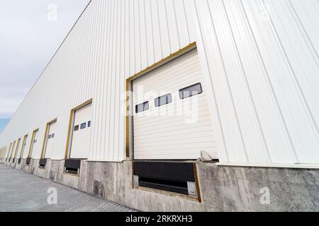 Warehouse gate for loading and unloading cargo in a distributed center Stock Photo