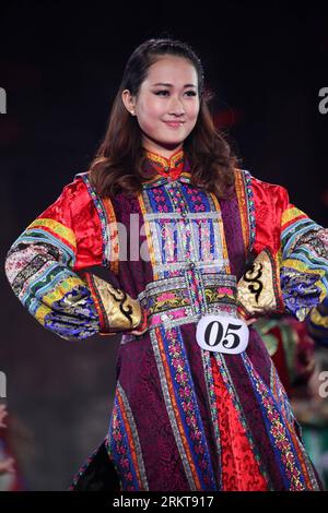 The China Miss World contestant Li Peishan poses for photographs ...
