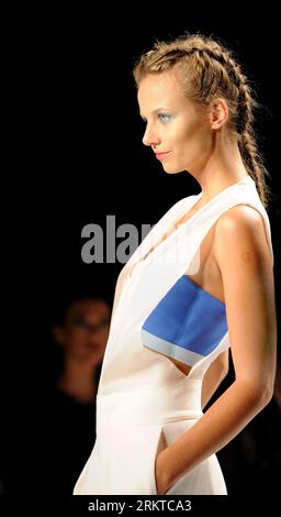 A model displays a creation by the Project Runway designer for the show ...