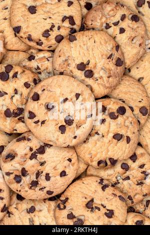 Chocolate Chip Cookies - Cookies are often served with beverages such as milk, coffee or tea and sometimes dunked, an approach which releases more fla Stock Photo
