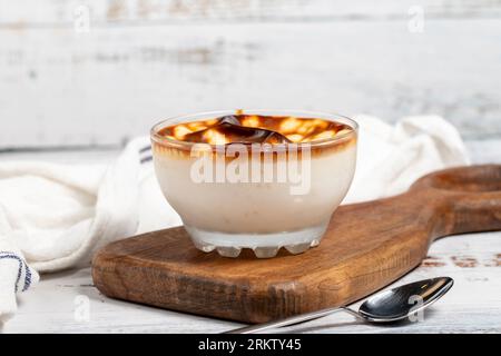 Rice pudding. Fresh delicious rice pudding on a white background. Mild dessert with milk and rice. Traditional Turkish cuisine delicacies. Local name Stock Photo