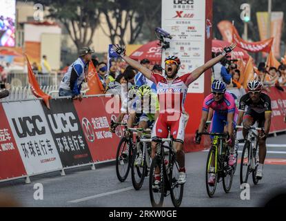 Bildnummer: 58582003  Datum: 12.10.2012  Copyright: imago/Xinhua (121012) -- BEIJING, Oct. 12, 2012 (Xinhua) -- Austria s Marco Haller (Front) of Katusha Team celebrates as he sprints over the finish line after the fourth stage of the 2012 Tour of Beijing cycling race in Beijing, China, October 12, 2012. Marco Haller claimed victory in the fourth stage with 3 hours 35 minutes and 39 seconds. (Xinhua/Zhang Yu) CHINA-BEIJING-CYCLING-TOUR OF BEIJING-FOURTH STAGE (CN) PUBLICATIONxNOTxINxCHN Radsport Rad Strasse Etappensieg premiumd x0x xmb 2012 quer      58582003 Date 12 10 2012 Copyright Imago XI Stock Photo