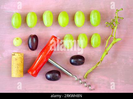 Wine grapes, cork,corkscrew, flat lay, abstract layout.Drink,autumn,season concept,free copy space Stock Photo