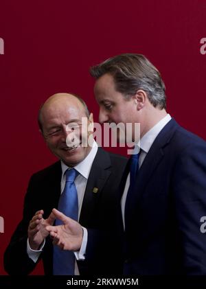 Bildnummer: 58741001  Datum: 23.11.2012  Copyright: imago/Xinhua (121123)  - BRUSSELS, Nov. 23, 2012 (Xinhua)  - British Prime Minister David Cameron (R) talks to Romanian President Traian Basescu during the family photo session of EU extraordinary summit in Brussels, capital of Belgium on Nov. 23, 2012. Top leaders of the European Union (EU) on Thursday began hard talks over the bloc s budget framework for 2014-2020 at a crucial summit amid competing demands of member states that could lead to all-night bargaining. (Xinhua/Zhou Lei)(yt) BELGIUM-EU-SUMMIT-BUDGET PUBLICATIONxNOTxINxCHN People P Stock Photo