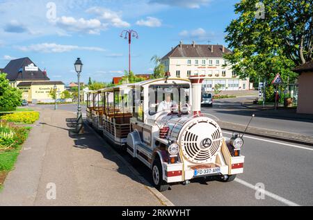 Ribeauville, France - July 5, 2023: Tourist train offers a way to discover Ribeauville and vineyards of Hunawihr in Alsace Stock Photo