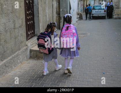 Gaza City, Palestine. 26th Aug, 2023. Palestinian children in school uniforms head to the first day of the new academic year in the Jabalia camp in the northern Gaza Strip. Credit: SOPA Images Limited/Alamy Live News Stock Photo