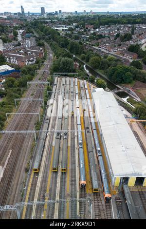 Winson Green, Birmingham, England, August 26th 2023. Parked up and unused West Midlands Railway trains at the Soho train maintenance depot in Birmingham during continued strike action. The industrial action, which is taking place across the country with services including West Midlands Trains, has been timed to coincide with the August Bank Holiday weekend. Pic Credit: Stop Press Media/Alamy Live News Stock Photo