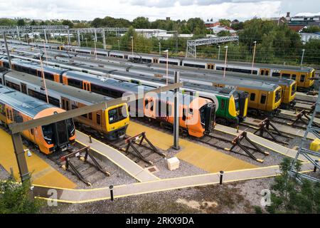 Winson Green, Birmingham, England, August 26th 2023. Parked up and unused West Midlands Railway trains at the Soho train maintenance depot in Birmingham during continued strike action. The industrial action, which is taking place across the country with services including West Midlands Trains, has been timed to coincide with the August Bank Holiday weekend. Pic Credit: Stop Press Media/Alamy Live News Stock Photo