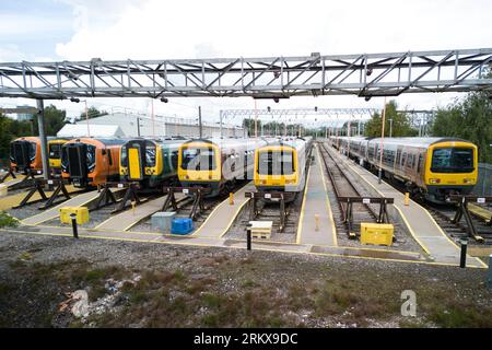 Winson Green, Birmingham, England, August 26th 2023. Parked up and unused West Midlands Railway trains at the Soho train maintenance depot in Birmingham during continued strike action. The industrial action, which is taking place across the country with services including West Midlands Trains, has been timed to coincide with the August Bank Holiday weekend. Pic Credit: Stop Press Media/Alamy Live News Stock Photo