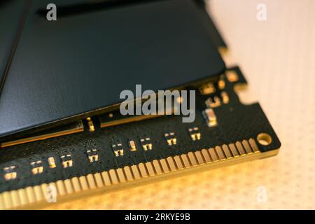 DDR4 DRAM memory module golden electrical contact macro. Computer RAM chip close-up. Desktop PC memory for assemble Stock Photo