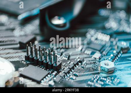 Motherboard with sockets and microchips close-up on modern powerful desktop PC. Computer hardware connectors components. Tech electronics background Stock Photo