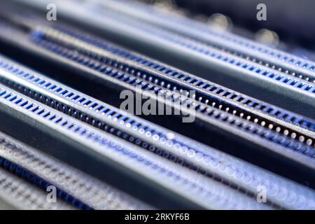 Blue DDR RAM memory slots sockets on motherboard close-up, desktop PC. Computer hardware chipset components background Stock Photo