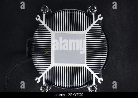 CPU unit cooling system radiator with spot for thermal paste, look down close-up. Desktop PC computer hardware electronics details components Stock Photo