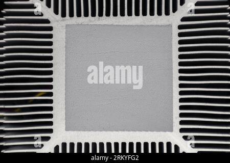 CPU cooling system radiator with spot for thermal paste, desktop PC look down macro, computer hardware electronics details components Stock Photo