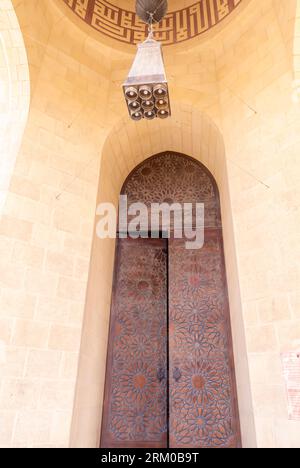 Doors in Al Fateh Grand Mosque, Door in Al Fateh Grand Mosque Bahrain. Opened door mosque Bahrain Stock Photo