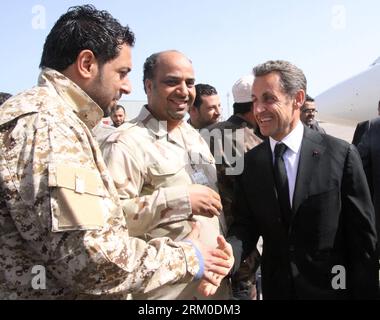 (130319) -- TRIPOLI, March 19, 2013 (Xinhua) -- Former French president Nicolas Sarkozy (R ) shakes hands with a Libyan soldier upon his arrival at Mitiga Airport in the Libyan capital Tripoli on March 19, 2013. (Xinhua/Hamza Turkia) LIBYA-TRIPOLI-SARKOZY-VISIT PUBLICATIONxNOTxINxCHN Stock Photo