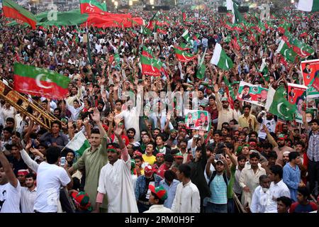 Bildnummer: 59420043  Datum: 23.03.2013  Copyright: imago/Xinhua Supporters of Imran Khan, former cricketer and leader of Pakistan Tehreek-e-Insaaf (PTI), wave party flags during a public meeting in eastern Pakistan s Lahore on March 23, 2013. Imran Khan is expected to unveil his manifesto to become Pakistan s next prime minister at an election rally on Saturday. (Xinhua Photo/Jamil Ahmed) PAKISTAN-LAHORE-ELECTION RALLY-IMRAN KHAN- PUBLICATIONxNOTxINxCHN Politik xas x0x 2013 quer premiumd     59420043 Date 23 03 2013 Copyright Imago XINHUA Supporters of Imran Khan Former Cricketer and Leader o Stock Photo