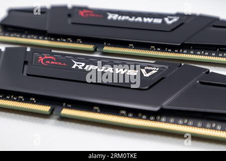 Kyiv, Ukraine - January 05, 2022: G.Skill Ripjaws V series DDR4 DRAM memory modules. Computer RAM chips on white. Desktop PC memory parts for assemble Stock Photo