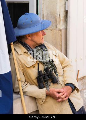 Man wearing blue pith helmet and binoculars - Preuilly-sur-Claise, Indre-et-Loire (37), France. Stock Photo