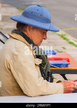 Man wearing blue pith helmet and binoculars - Preuilly-sur-Claise, Indre-et-Loire (37), France. Stock Photo