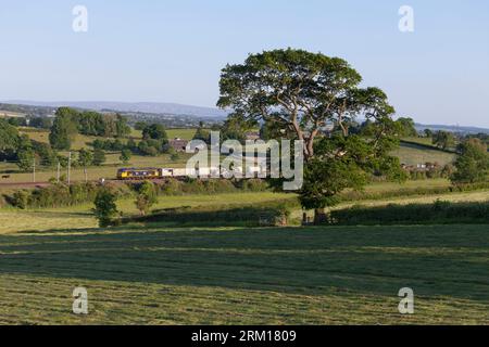 GB Railfreight class 69 diesel locomotive 69001 on the west coast mainline passing the Cumbrian countryside with a weed killing train Stock Photo