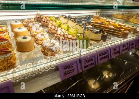 Cakes display, sweets shop, desserts display in Gourmet Lounge Ritz hotel Bahrain Stock Photo