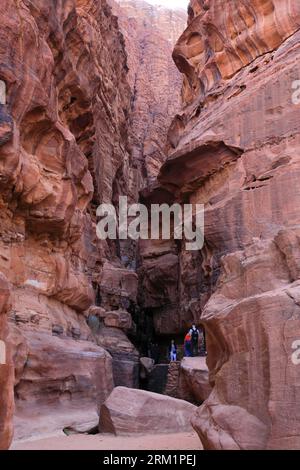 People in the Khazali canyon, famous for the ancient inscriptions and waterholes, Wadi Rum, Jordan, Middle East Stock Photo