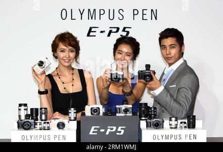 130513 -- SEOUL, May 13, 2013 Xinhua -- Models display Olympus s new hybrid mirrorless camera OLYMPUS PEN E-P5 during a launch event in Seoul, capital of South Korea, May 13, 2012. The OLYMPUS PEN E-P5 will go on sale in June in South Korea. Xinhua/Park Jin-Hee SOUTH KOREA-OLYMPUS-CAMERA-PEN E-P5-LAUNCH PUBLICATIONxNOTxINxCHN Stock Photo