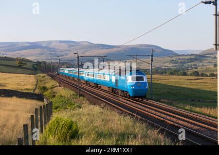 The Locomotive Services Blue Pullman luxury dining train on the west coast mainline passing the Cumbrian countryside. It is a converted Intercity 125. Stock Photo