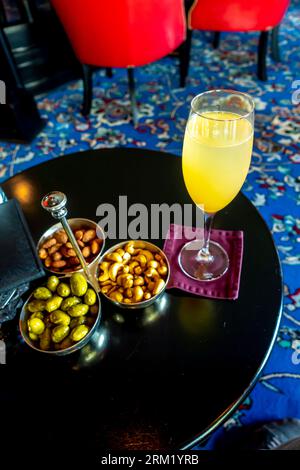 A glass of Bellini cocktail served Burlington Club bar interior, Al Seef District, Manama, Bahrain Stock Photo