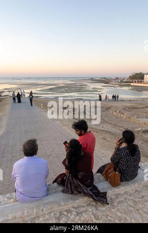 Tourists at the ruins of Tylos Fortress, Tylos Fort ruins, Bahrain Fort museum, Qal'at al-Bahrain - Bahrain Fort, Fortress in Al Qala, Bahrain Stock Photo