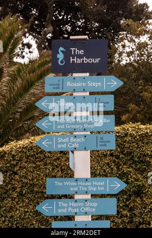 Herm, Channel Islands. 11 June 2023.  Blue painted signs point to various locations on the island of Herm, one of the Channel Islands. Stock Photo