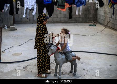 Gaza, Palestine. 26th Aug, 2023. Palestine refugee children play inside their home in the Jabalia refugee camp in the northern Gaza Strip. (Photo by Mahmoud Issa/SOPA Images/Sipa USA) Credit: Sipa USA/Alamy Live News Stock Photo