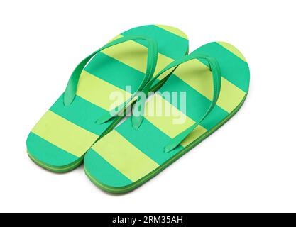 Pair of striped flip-flops in green yellow colours isolated on white backround Stock Photo