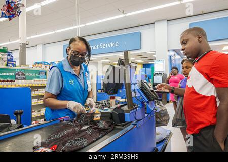 Augusta Georgia,Walmart Supercenter Supercentre,discount department store,checkout line queue customers checking out paying buying,Black African,ethni Stock Photo