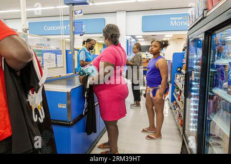 Augusta Georgia,Walmart Supercenter Supercentre,discount department store,checkout line queue customers checking out paying buying,Black African,ethni Stock Photo