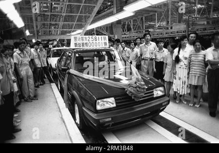 Bildnummer: 60123037  Datum: 14.07.2013  Copyright: imago/Xinhua  File photo taken on Aug. 1, 1994 shows the first sedan by the China-German joint venture automotive manufacturer FAW-VW rolling off the assembling line in Changchun, capital of northeast China s Jilin Province. The First Automotive Works Group (FAW) will have its 60th founding anniversary on July 15, 2013, which also marks the history of China s auto industry. Founded in 1953, the auto maker is known as the cradle of China s automobile industry for it produced the country s first self-made truck, the Jiefang, in 1956. Since then Stock Photo